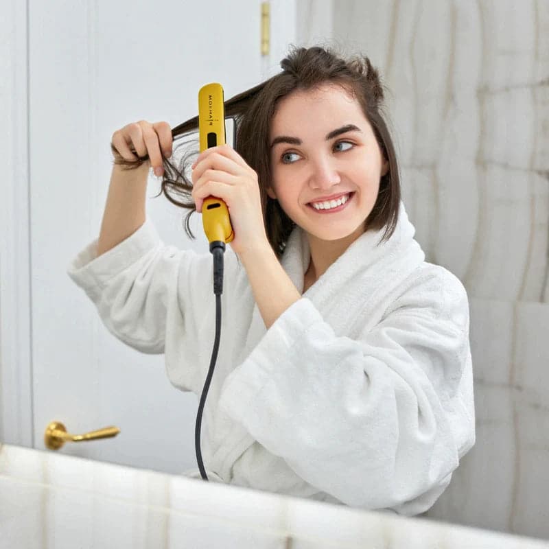 Lady using Moehair Professional 1.5” Hair Straightener